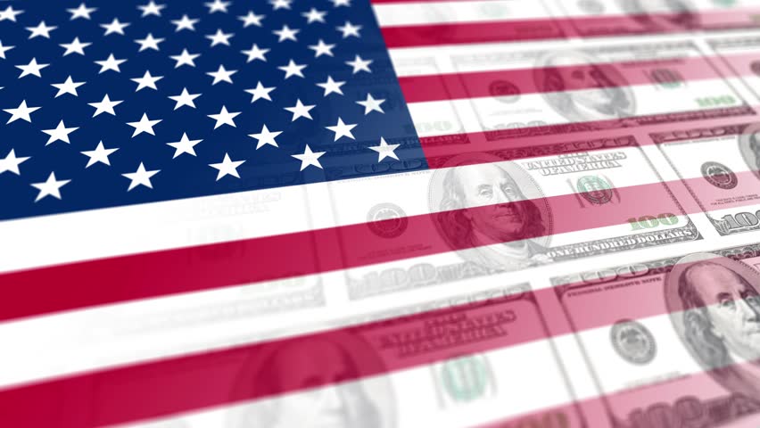 Slight movement of the US flag with fading and blurring of $100 bills