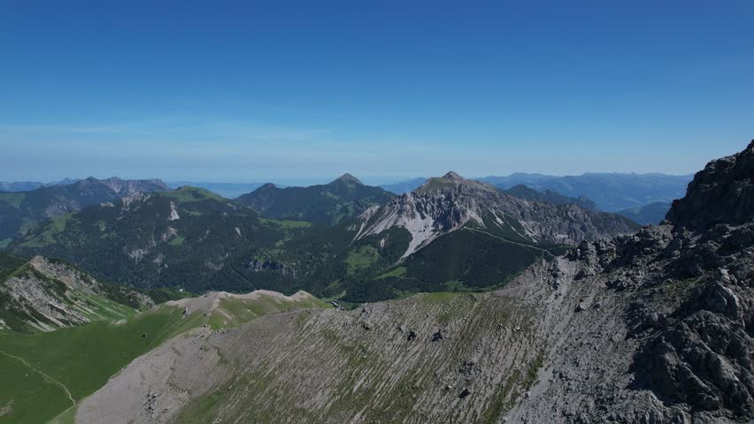 Flying over beatiful village in the alps in Fürstentum Liechtenstein called Malbun.
