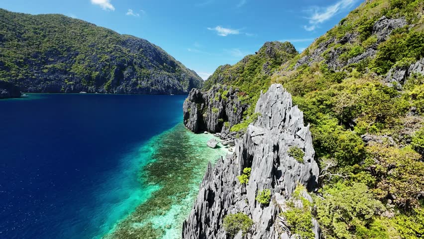 Limestone cliffs and coral reef coastline in El Nido, Palawan seen from above