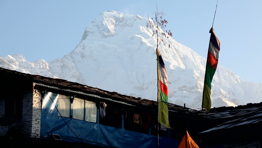 Himalayan Mountain Peak Buddhist Prayer Flags In Nepal. Annapurna South is 7219m