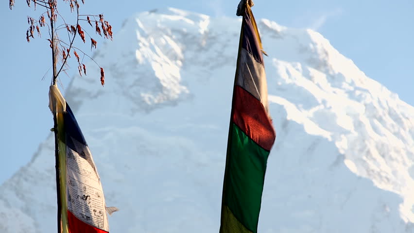 Himalayan Mountain Peak Buddhist Prayer Flags In Nepal. Annapurna South is 7219m