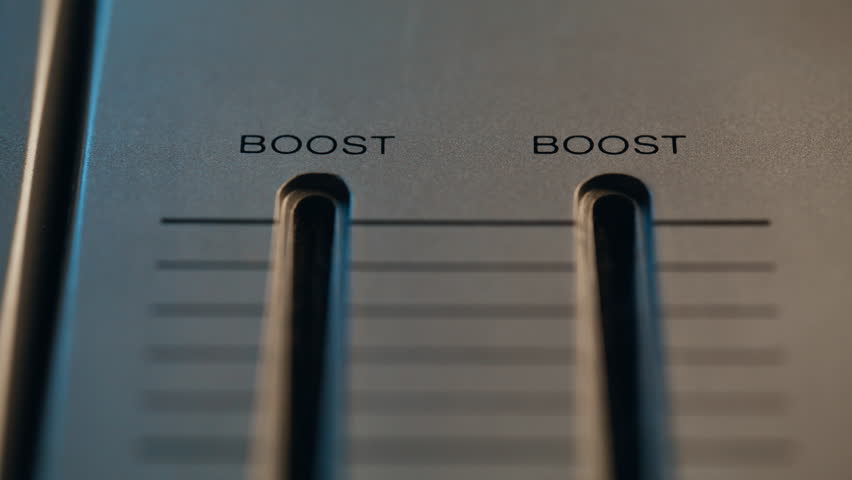 Hands moving sliders soundboard to maximum closeup. Unrecognizable man working on professional digital audio channel mixer. Sound engineer adjusting volume on vintage music recording equipment indoors