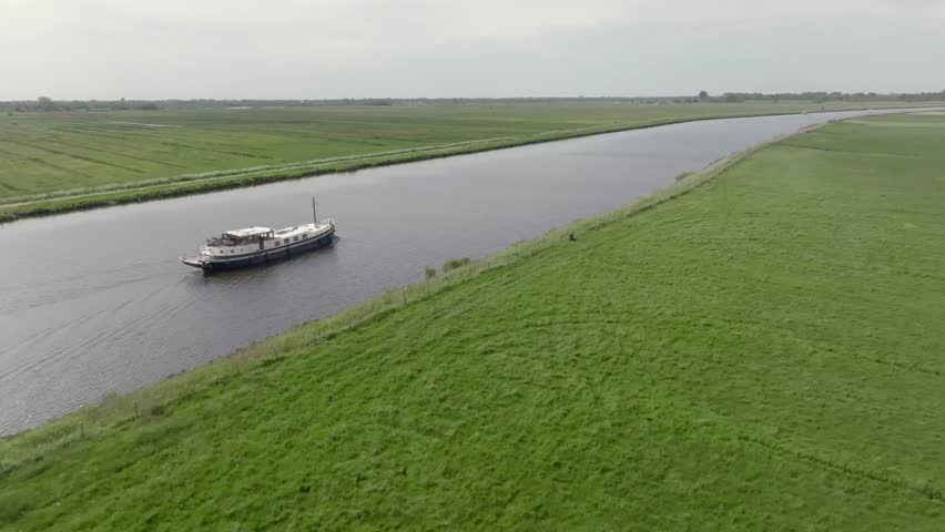 Aerial View Of Boat Cruising In The Canal Of Friesland, Netherlands.
