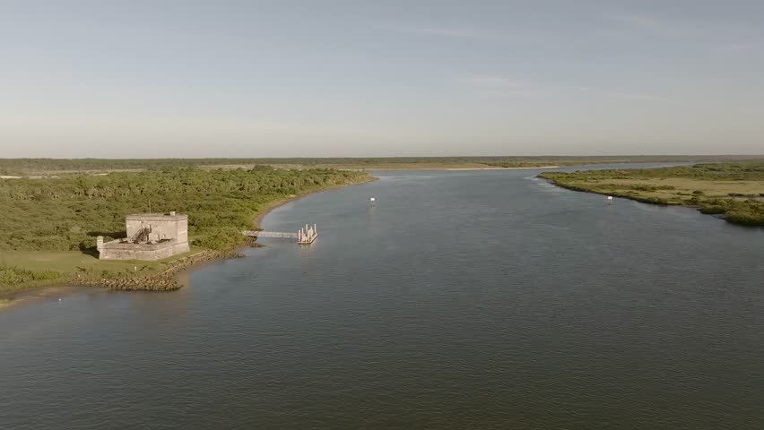Aerial view of the historic Fort Matanzas, where the dark waters meet the lush green shores, St. Augustine, Florida, United States.