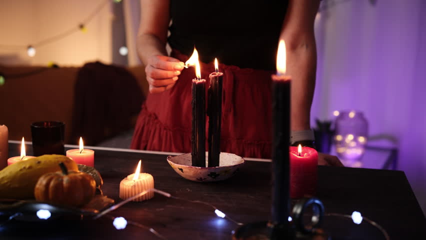 Girl Decorates A Halloween Room And Lights Up Candles With Matches
