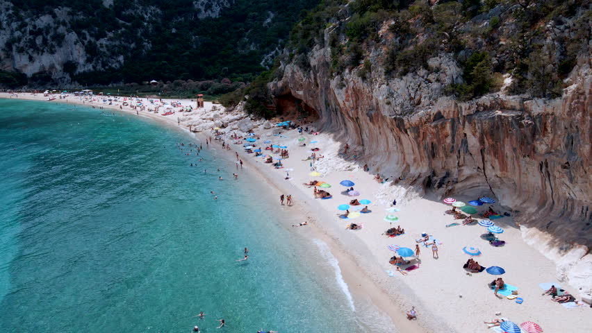 Forward Aerial Drone Flyover of Cala Luna Beach – Turquoise Waters and Sandy Shore, Sardinia