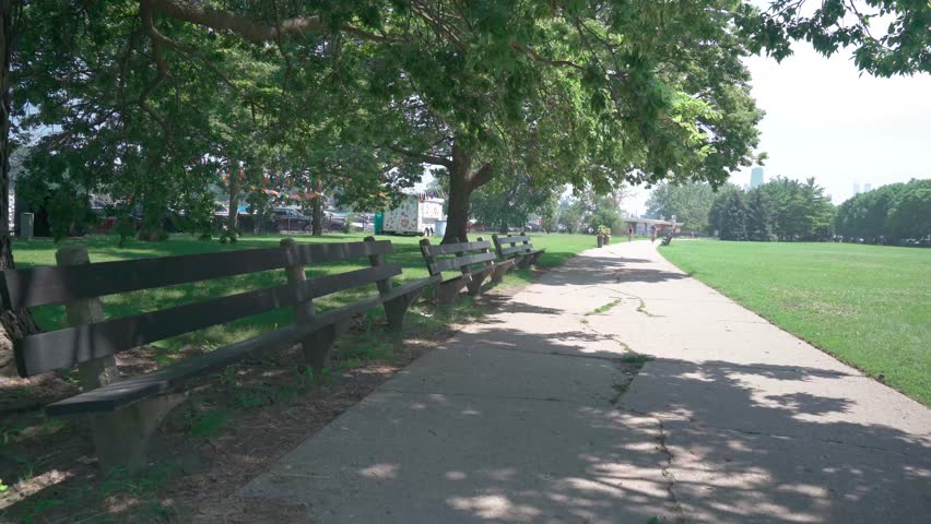 Cyclists Ride Along Lincoln Park Trail in Chicago
