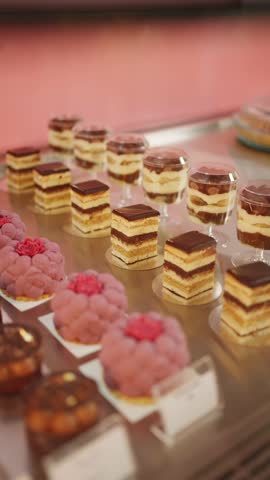 A variety of sweet desserts in a pastry shop window. Concept of a pastry shop window.