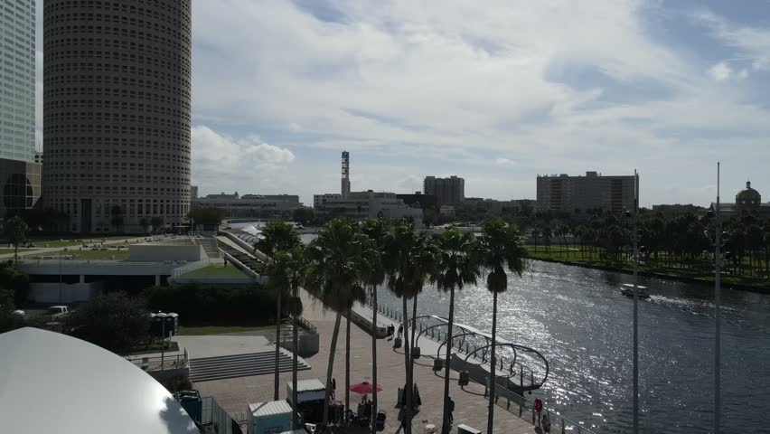 Drone rises up out of Curtis Hixon Waterfront Park and heads toward the Hillsborough River in Tampa, Florida, USA