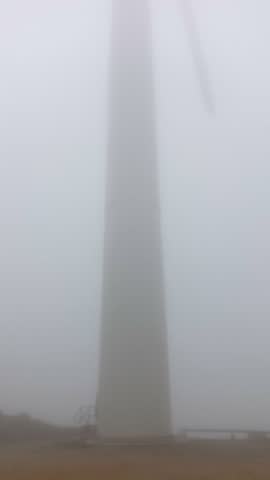 Wind generator in foggy morning in Parque Eolico - El Cabrito in Tarifa, Spain