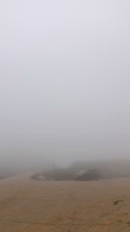 Wind generator in foggy morning in Parque Eolico - El Cabrito in Tarifa, Spain