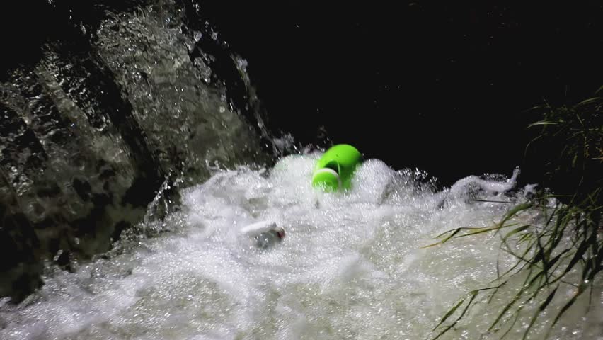 Floating plastic waste polluting a body of water. The video highlights environmental damage and water contamination, ideal for topics like ecology, plastic pollution, and climate awareness.