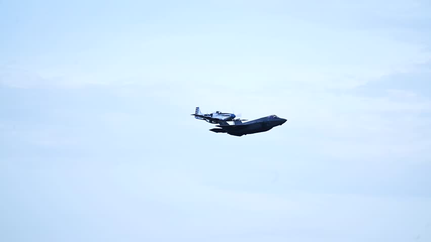 The F-35 fighter jet flew alongside the P-51 Mustang aircraft.