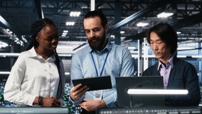 Happy data center colleagues collaborating on neural network software development. Cheerful teamworking server hub coworkers implementing machine learning technology in workplace, camera A - Powered by Shutterstock - Get 15% off with code: PIKWIZARD15