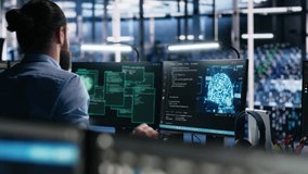 Server farm programmers seeing hacking warning, working to secure systems from cyberattack accessing confidential data. Team of data center coworkers fighting virus during security breach, camera A - Powered by Shutterstock - Get 15% off with code: PIKWIZARD15