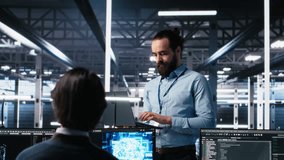 Manager supervising work of server room engineer using AI to review infrastructure diagnostics on devices. Tech company supervisor overseeing IT expert in data center analyzing data using AI, camera A - Powered by Shutterstock - Get 15% off with code: PIKWIZARD15