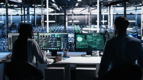 Server farm programmers seeing hacking warning, working to secure systems from cyberattack accessing confidential data. Team of data center coworkers fighting virus during security breach, camera A - Powered by Shutterstock - Get 15% off with code: PIKWIZARD15