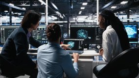 Server room computer scientists using AI to review infrastructure diagnostics. IT specialists working together in data center, analyzing performance data using artificial intelligence tech, camera A - Powered by Shutterstock - Get 15% off with code: PIKWIZARD15