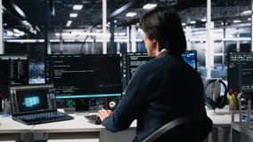 Admin in high tech data center coding with machine learning generative AI assistant. Worker using artificial intelligence neural networks large language model technology, camera A - Powered by Shutterstock - Get 15% off with code: PIKWIZARD15