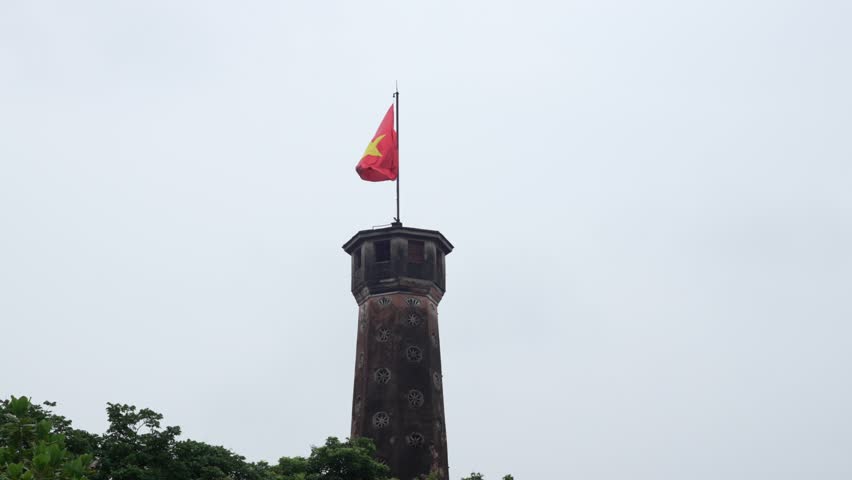 Vietnam Socialist Republic communist country flag yellow star red background tower top Hanoi