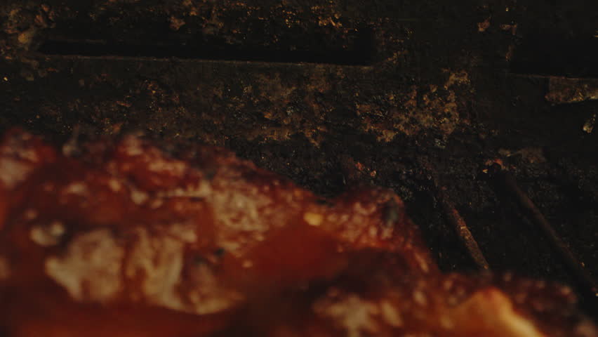 Beautiful dolly out of deliciously grilled spareribs on a dirty barbecue