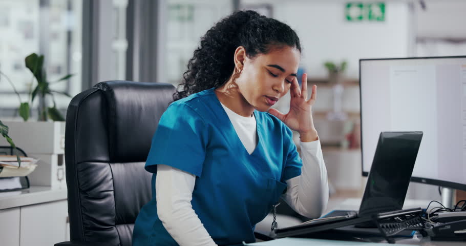 Frustrated woman, nurse and receptionist with headache on laptop for stress, overworked or pressure. Female person, medical worker or secretary with migraine or strain on computer at front desk