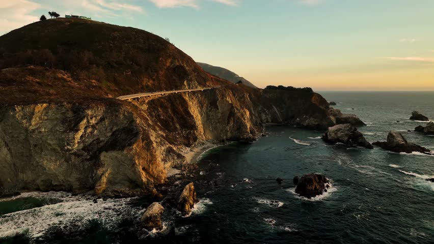 Aerial view of the Bixby Creek Bridge, a concrete arch bridge that spans a steep coastal canyon carved by Bixby Creek, Big Sur, California, United States.