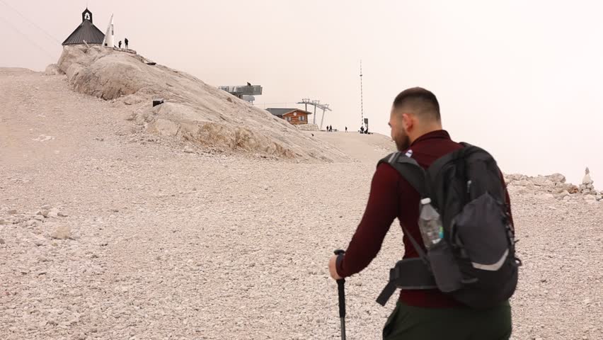 A man is going on a hiking trip in the mountains.
