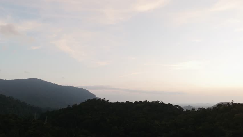 Serene mountain landscape at dusk with soft pastel skies and rolling hills. Peaceful and natural atmosphere ideal for travel, meditation, or nature-themed visuals.
