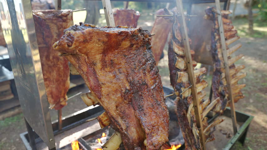 Traditional Argentine asado with ribs roasting over open flame, culinary heritage