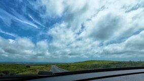 Countryside View from Car Dashcam POV Driving Along Rural Road in Wales with Open Landscape with Open Land on Either Side. Travel, Transportation, Nature Footage. - Powered by Shutterstock - Get 15% off with code: PIKWIZARD15
