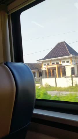 Surabaya, Indonesia, July 11, 2025 - View from the train window before arriving at Pasar Turi Station in Surabaya City. 