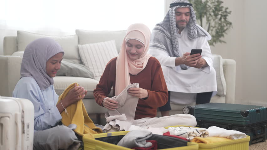 Muslim family preparing luggage for travel trip packing clothes into suitcase for international, holiday lifestyle vacation, halal trip planning, muslim tourism agency, muslim airline, ramadan journey