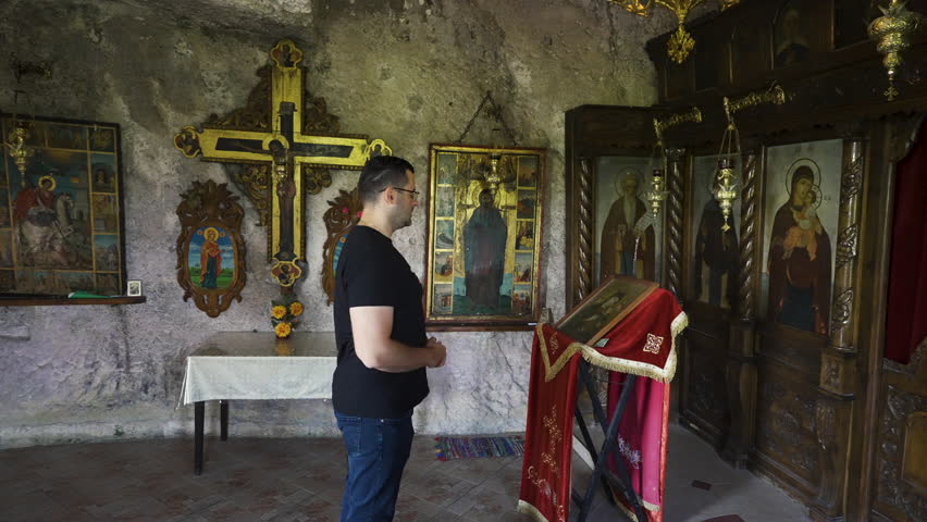 Man Inside The Basarbovo Monastery - Monastery of Saint Dimitar Basarbowski In Ruse, Bulgaria - wide shot