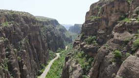 Aerial view a  winding track among the rocks in Armenia. A picturesque highway. Winding mountain road among the mountains In Syunik province, Armenia. Roks near Noravank monastery - Powered by Shutterstock - Get 15% off with code: PIKWIZARD15