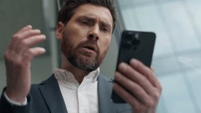 Close up unhappy frustrated Caucasian middle-aged business man reading bad news with mobile phone online failure upset in office worried stressed businessman male manager employer smartphone problem - Powered by Shutterstock - Get 15% off with code: PIKWIZARD15