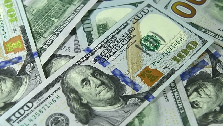 Background of US dollar bills. Pile of american cash. One hundred usd dollars banknotes 