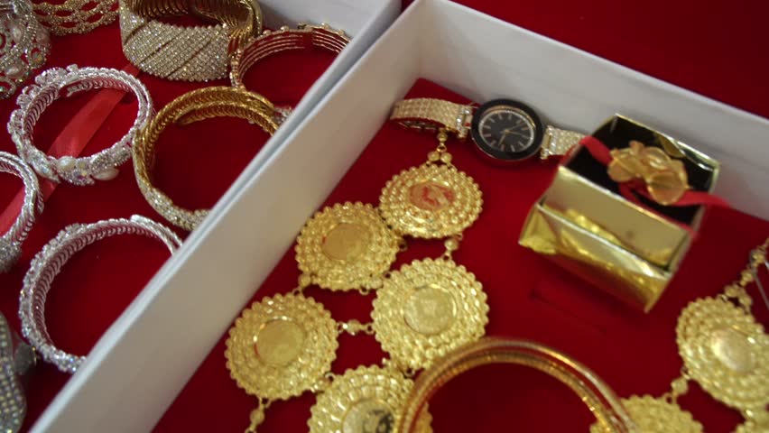 Gold jewelry in the paper box for Muslim bride. Prepare a wedding ceremony