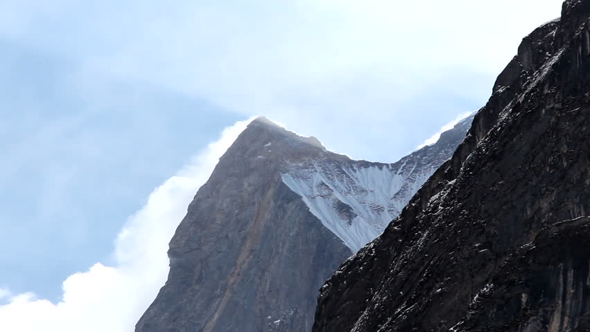 Snow Blows Off Holy Himalayan Peak Machapuchre Fishtail. Shot in full HD