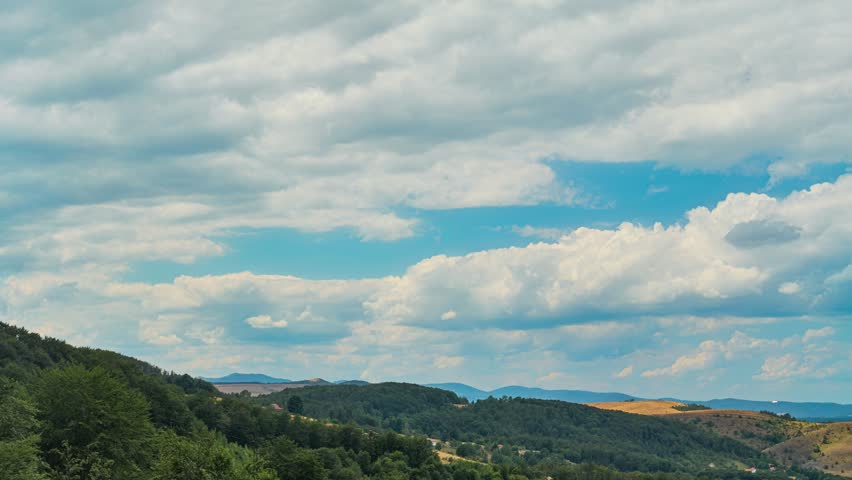 Nature landscape clouds rolling over hills and mountains time-lapse