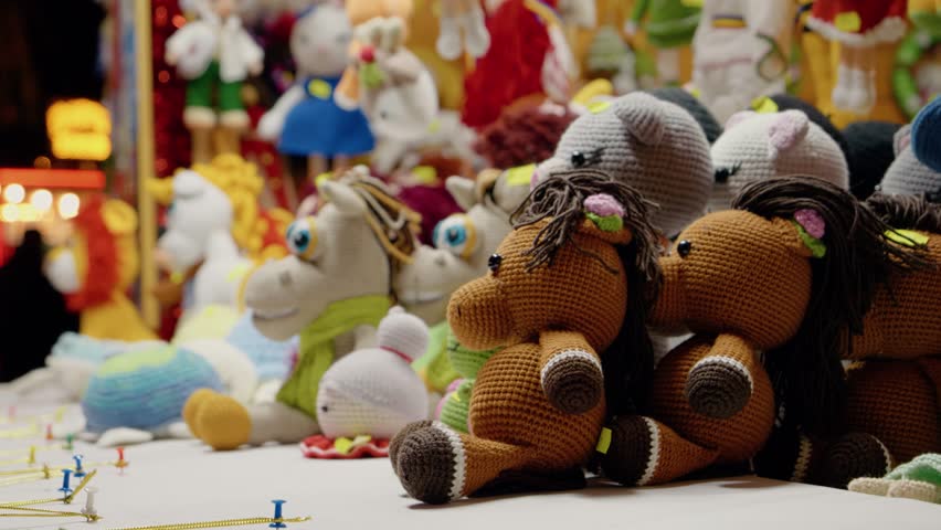 Explore the charming array of handmade toys showcased at the Christmas market, featuring vibrant colors and unique designs during the holiday season.