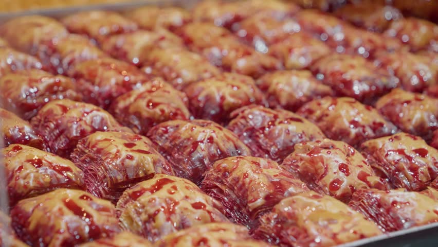 Discover the delightful flavors of traditional sweets at the Christmas market, featuring an array of sugar-coated desserts perfect for the festive season.
