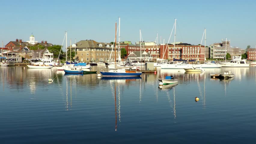 Boats docked in harbor with buildings in portsmouth new hampshire