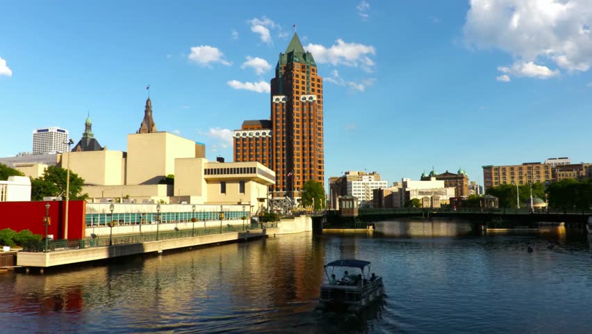 Milwaukee cityscape with river and buildings on a sunny day in wisconsin