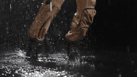 A captivating display of dynamic movement in the rain, showcasing bold fashion and vibrant water reflections - Powered by Shutterstock - Get 15% off with code: PIKWIZARD15