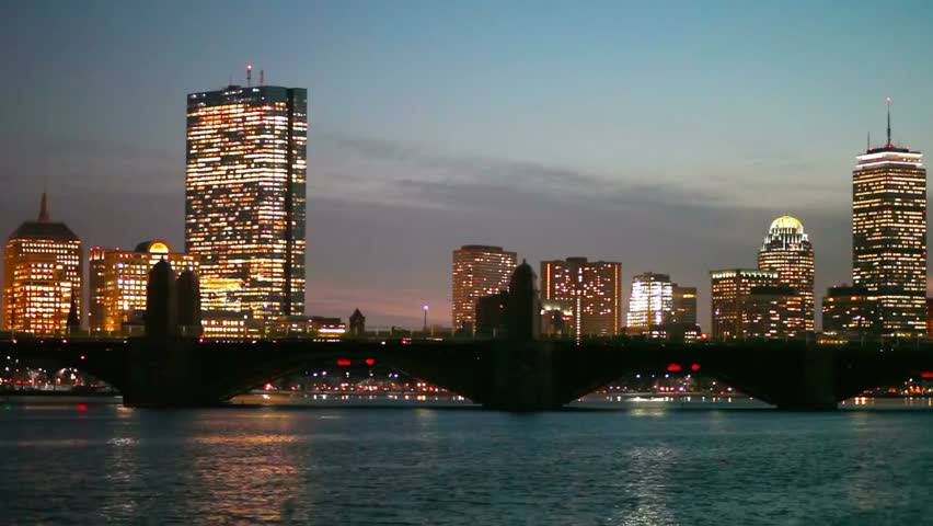 Boston massachusetts skyline at night with illuminated buildings and bridges