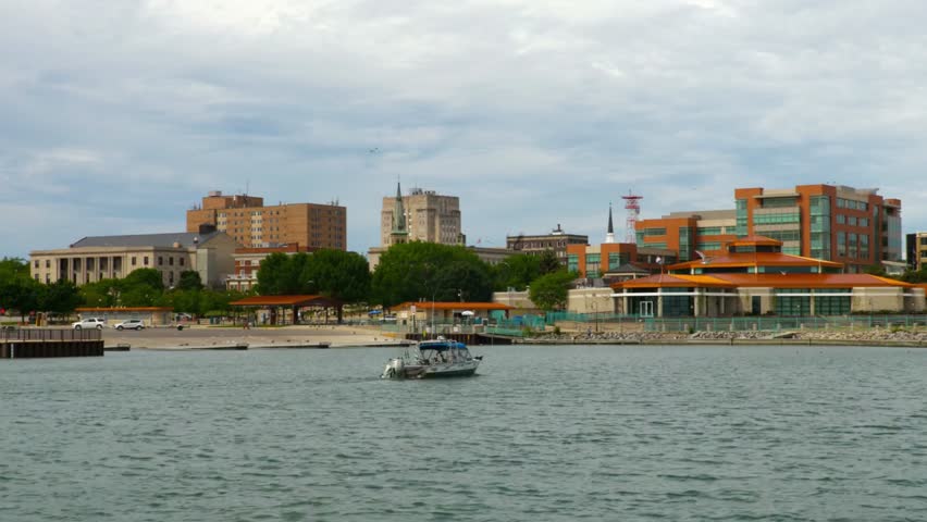 Boat on lake erie with the erie pennsylvania skyline in the background