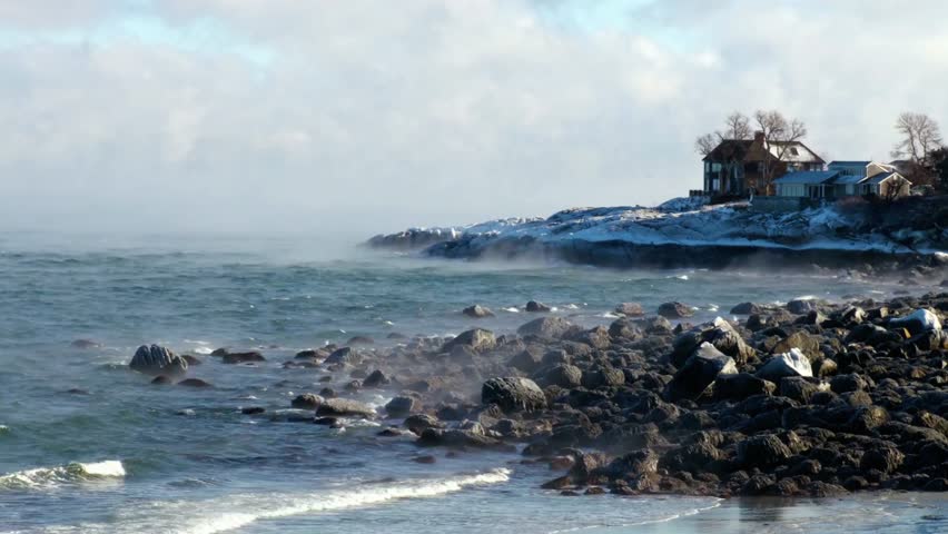 Rocky coastline with a house on a cliff overlooking the ocean