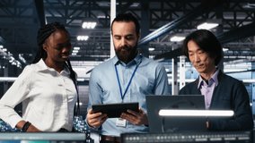 Happy data center coworkers monitoring neural network AI LLM visualization. Jolly workers in high tech facility using devices to oversee servers powering machine learning processes, camera A - Powered by Shutterstock - Get 15% off with code: PIKWIZARD15
