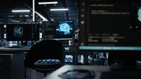 Monitors in data center displaying AI tech software interface monitoring infrastructure health. Visual programming systems on PCs helping identify malfunctions in server hub equipment - Powered by Shutterstock - Get 15% off with code: PIKWIZARD15